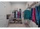 Walk-in closet features ample storage with shelving and racks for organized clothing and accessories at 25 Bourne Dr, Franklinton, NC 27525