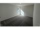 A comfortable bedroom featuring neutral walls, plush carpeting, and a window allowing for ample natural light at 275 Magnolia Run Way, Benson, NC 27504