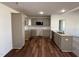 Modern kitchen features granite countertops, stainless steel appliances, and wood-look flooring at 275 Magnolia Run Way, Benson, NC 27504
