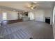Open floor plan view of the living room, connecting to the kitchen and dining area at 275 Magnolia Run Way, Benson, NC 27504