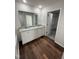 Elegant main bathroom with double sinks, granite counters, and a walk-in closet at 275 Magnolia Run Way, Benson, NC 27504