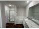 Beautiful bathroom with double sinks, granite counters, a tub, and a shower at 275 Magnolia Run Way, Benson, NC 27504