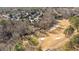 Aerial view of the community featuring wooded areas, a golf course, and beautiful homes at 2933 Elmfield St, Raleigh, NC 27614