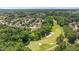 An aerial view of a community showcasing a golf course and surrounding trees at 2933 Elmfield St, Raleigh, NC 27614