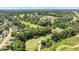 High aerial shot showcasing the surrounding lush greenery, neighboring homes and golf course at 2933 Elmfield St, Raleigh, NC 27614