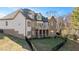 Beautiful back exterior showcasing a private deck, patio, and fenced-in yard at 2933 Elmfield St, Raleigh, NC 27614