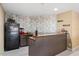 Features a cozy bar area with a refrigerator and vintage popcorn machine at 2933 Elmfield St, Raleigh, NC 27614