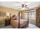 Bedroom featuring a four-poster bed, side tables, and a ceiling fan at 2933 Elmfield St, Raleigh, NC 27614
