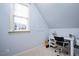 Bright bedroom featuring a desk, plush carpeting, and natural light from a large window at 2933 Elmfield St, Raleigh, NC 27614