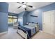 Blue-themed bedroom with an airplane accent, large window, and comfortable armchair at 2933 Elmfield St, Raleigh, NC 27614