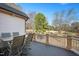 Spacious outdoor deck featuring neutral furnishings and overlooking a wide, wooded backyard with mature trees at 2933 Elmfield St, Raleigh, NC 27614