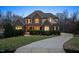 Charming stone and siding home with inviting front yard and long driveway at 2933 Elmfield St, Raleigh, NC 27614