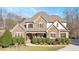 Traditional home boasting stone and siding exterior, with a well-kept front yard at 2933 Elmfield St, Raleigh, NC 27614