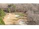 Scenic view of a lush green golf course with sand traps and mature trees at 2933 Elmfield St, Raleigh, NC 27614