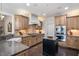 Spacious kitchen featuring a center island, granite countertops, and custom cabinetry at 2933 Elmfield St, Raleigh, NC 27614