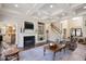 Elegant living room with fireplace, built-ins, coffered ceiling, and hardwood floors at 2933 Elmfield St, Raleigh, NC 27614