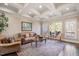 Bright living room featuring hardwood floors, large windows, and comfortable seating at 2933 Elmfield St, Raleigh, NC 27614