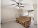 Comfortable living room with a large brown couch and a ceiling fan at 2933 Elmfield St, Raleigh, NC 27614