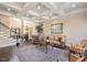 Spacious open-concept living room with hardwood floors, a coffered ceiling, and elegant seating arrangement at 2933 Elmfield St, Raleigh, NC 27614