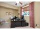 Well-lit home office with a neutral color palette and custom desk at 2933 Elmfield St, Raleigh, NC 27614