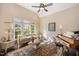 Cozy sitting room with hardwood floors, a vaulted ceiling, and a large window overlooking the backyard at 2933 Elmfield St, Raleigh, NC 27614