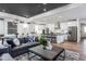 Spacious open-concept living room with modern décor and a connected kitchen and dining area at 294 Arcadius Dr, Clayton, NC 27520