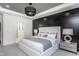 Luxurious main bedroom showcasing a modern aesthetic, accent wall and sophisticated decor at 294 Arcadius Dr, Clayton, NC 27520