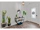 Bright foyer with hardwood floors, decorative table, and a view of the front door at 3012 Freeman Farm Way, Rolesville, NC 27571