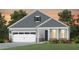 Charming home with vertical siding, complemented by a well-manicured lawn and colorful plantings at 304 Arcadius Dr, Clayton, NC 27520