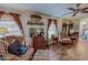 Spacious living room with entertainment center, windows, and comfortable seating at 3134 Magnolia Ln, Stem, NC 27581