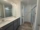 Beautiful bathroom featuring double vanity with modern fixtures and glass enclosed shower at 314 Church St # 37, Wendell, NC 27591