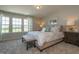 Beautifully staged main bedroom suite with large windows and decorative furniture at 314 Church St # 37, Wendell, NC 27591