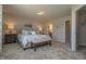 Comfortable main bedroom with plush carpet, neutral walls, and a well-lit en-suite bathroom at 314 Church St # 37, Wendell, NC 27591