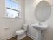Convenient downstairs powder room with modern sink and window at 314 Church St # 37, Wendell, NC 27591