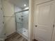 Shower with glass doors featuring tile surround and brushed nickel fixtures at 314 Church St # 37, Wendell, NC 27591
