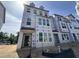 New construction townhome featuring large windows and modern design, offering an attractive facade in a developing community at 315 Chesapeake Commons St # 102, Garner, NC 27529