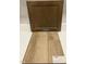 Showcasing luxury vinyl plank flooring with a stain sample and matching cabinet at 315 Chesapeake Commons St # 102, Garner, NC 27529
