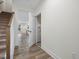 Open hallway featuring stairs and wood-look flooring at 318 Church St # 39, Wendell, NC 27591