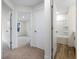 Hallway with views into the bathroom and bedroom, and a neutral color scheme at 318 Church St # 39, Wendell, NC 27591