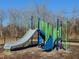 Community playground with a slide, climbing structure, and a wood chip ground cover at 318 Church St # 39, Wendell, NC 27591