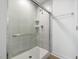 Modern shower with glass door and tiled walls, complemented by sleek fixtures and design at 318 Church St # 39, Wendell, NC 27591