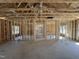 Spacious living room with exposed framing, allowing for customization and design flexibility at 327 S Main St, Four Oaks, NC 27524