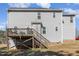 Exterior view of the back of the house, featuring a wooden deck and a grey siding at 329 Silver Creek Dr, Clayton, NC 27520