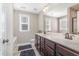 Bathroom features a double sink vanity, large mirror, and neutral walls and floors at 329 Silver Creek Dr, Clayton, NC 27520