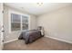 Neutral bedroom with a shark pillow next to a window with views of the outside at 329 Silver Creek Dr, Clayton, NC 27520