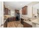 Spacious kitchen with dark cabinets, granite counters and stainless steel appliances at 329 Silver Creek Dr, Clayton, NC 27520