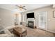Inviting living room featuring neutral walls, plush carpeting, and a cozy fireplace at 329 Silver Creek Dr, Clayton, NC 27520