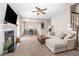 Bright and airy living room with fireplace seamlessly connected to the dining area at 329 Silver Creek Dr, Clayton, NC 27520