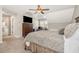 Comfortable bedroom featuring a ceiling fan and a wooden dresser with a TV at 329 Silver Creek Dr, Clayton, NC 27520
