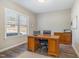 Bright office space with a large window, wood desk, and neutral tones at 329 Silver Creek Dr, Clayton, NC 27520